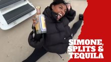 Simone Biles hits a split with a tequila bottle