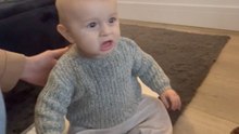 Little girl coaches her baby brother to utter his first word