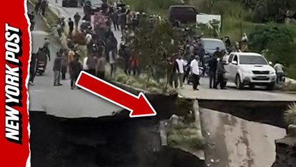 Terrifying moment highway crumbles as drivers watch in panic