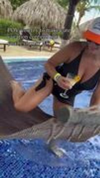 Woman Attempts Hammock Swing Entry