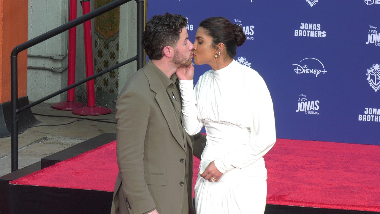 Joe Jonas and Priyanka Chopra pose together at the Jonas Brothers handprint-footprint ceremony in Hollywood