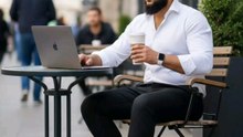 "Chillin' and workin' vibes ☕️💻! Caught in the moment: a stylish dude crushing it on his MacBook at a cozy outdoor café. Coffee in one hand, productivity in the other 🔥. #ProductivityVibes #CaféLife #WorkMode #OutdoorWork"