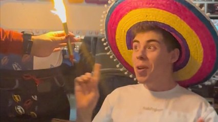 Waiters wish a 'Happy Birthday' to a completely confused boy at the restaurant