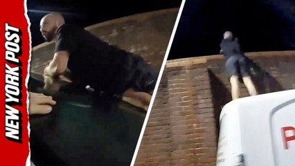 Suspect leaps onto police van, over wall in daring escape