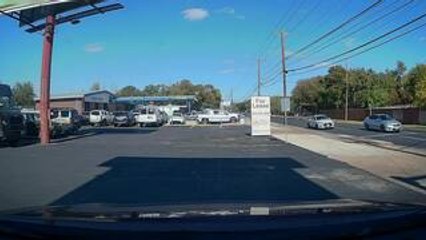 Person Gets Stuck Trying to Drive Under Signboard With Bike on Car Roof