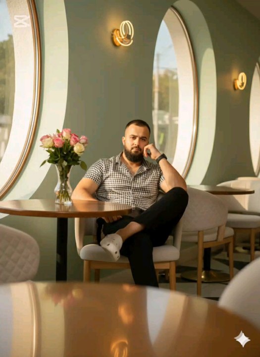 "Chillin’ in my favorite café vibe 🌿☕️ — black & white checkered shirt, comfy Crocs, and a splash of pink roses on the table. Just soaking up the good vibes and good coffee! #CafeLife #ChillVibes #OOTD #CoffeeTime"