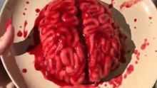 Baker transforms simple ingredients into a gory yet irresistible Halloween 'brain' cake