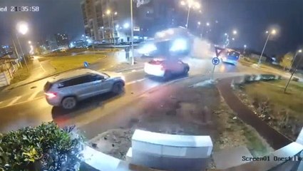 Moment out of control Mercedes flies over cars on busy road after hitting roundabout