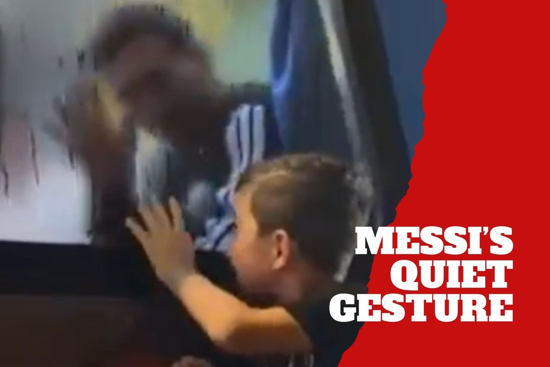 Lionel Messi pauses to make a young fan’s day outside the team bus