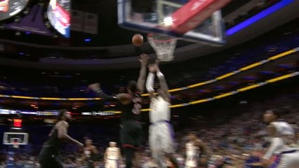 Doncic combines with Deandre Ayton for the alley-oop