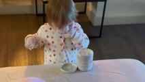 Little girl covers herself and the whole room in nappy rash cream