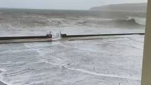 Waves crash over Laxey Promenade amid Storm Bram