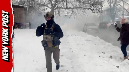 Illinois street erupts in smoke as crowd pelts officers with snowballs
