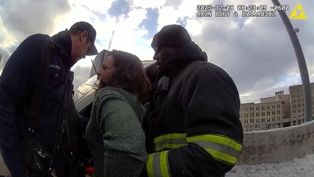 Dramatic moment shows cops rescuing FBI agent from car dangling from overpass