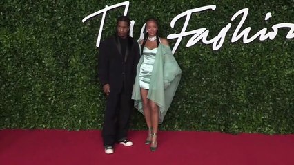 Rihanna Displays Bare Baby Bump In Tiny Snakeskin Crop Top After Returning From PFW