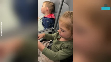 Sister Soothes Big Brother to Sleep on Her Lap During Flight