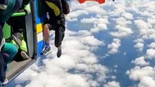 Terrifying moment skydiver left dangling after parachute snags