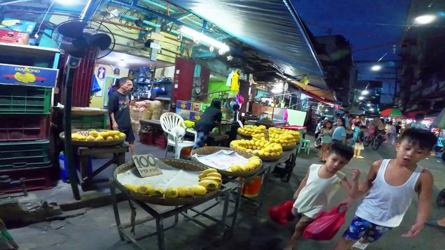 Playful Kids Along Elcano Street in Manila City in the Philippines