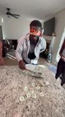 Blindfolded Man Fails to Pick Up Money With Ladle in Game