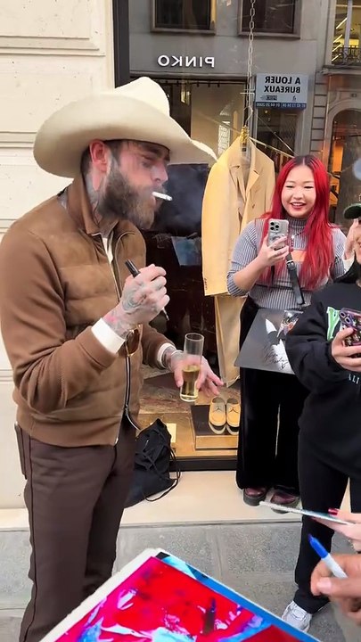 Post Malone takes picture with fans in Paris