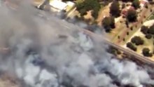Dangerous, out-of-control bushfire burns in Perth suburb