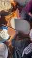 Woman Preparing Traditional Flatbread in Sunlit Kitchen