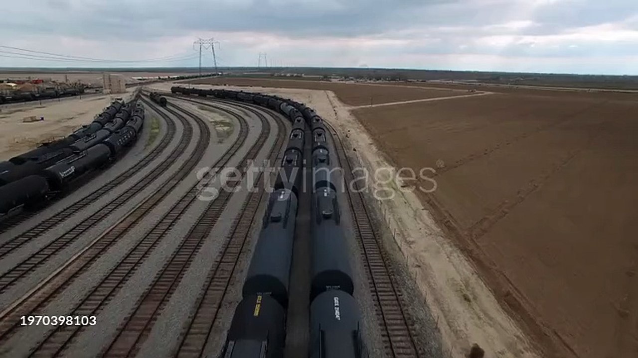 Aerial Of Freight Trains In Tranquil Shunting Yard Under Cloudy Sky - Bakersfield, California - 4K stock videogettyimages-1970398103-640_adpp