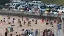 Dramatic video shows panic as gunshots heard in deadly Bondi Beach attack