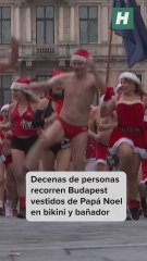 Decenas de personas recorren Budapest vestidos de Papá Noel en bikini y bañador