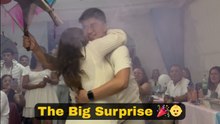 Parents-to-be surprise loved ones by doing a surprise gender reveal during a lively gathering