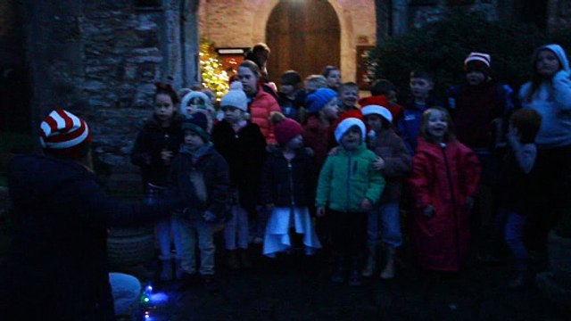Carol singing by pupils of Porlock First School during the village's Christmas lights switch on, filmed by George Ody.