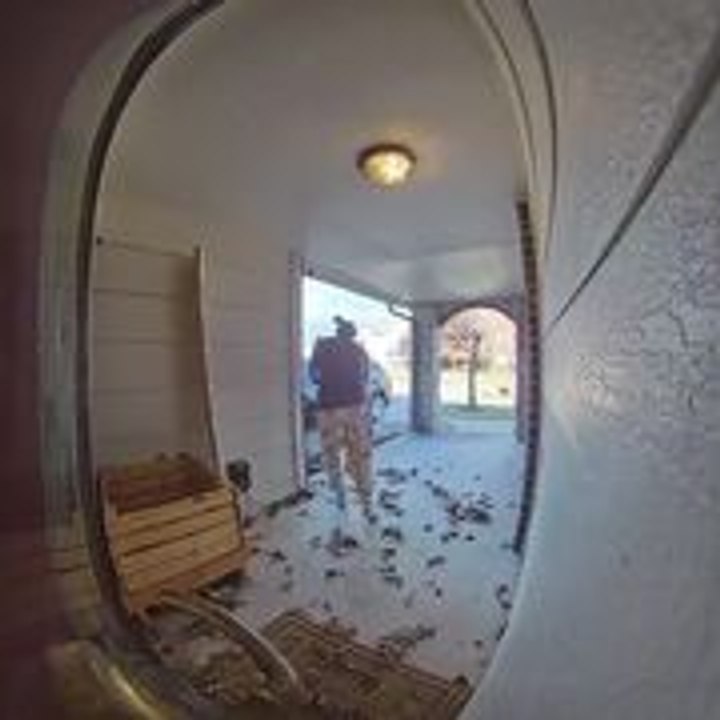 Woman Sweeps Dried Leaves Outside and Wind Blows Them Back In