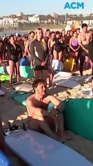 Thousands paddleout at Bondi Beach to pay tribute