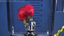 Blender grinds strawberries slow motion