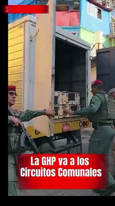 Venezuela's military distributing rifles to the people in working-class districts. These militias will form an armed resistance to defend their nation if the USA tries to occupy the country.