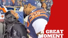 Simone Biles receives a special gesture from Jonathan Owens during Bears vs. Packers