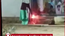 TDP Woman Leader Sets Fire to YS Jagan’s Birthday Flex in Lepakshi Mandal