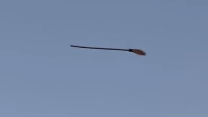 Broom mysteriously hangs in the air as if a witch left it floating
