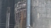 Worker captures dramatic moment an aging grain silo suddenly gives way and collapses