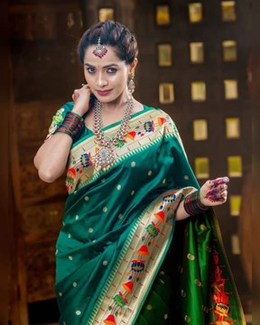 Indian celebrity in traditional look in green saree