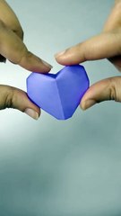 A tiny heart, folded in purple.