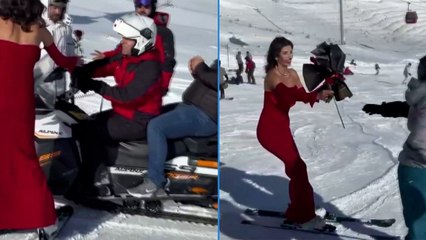 Erciyes’te renkli anlar: Kırmızı elbisesiyle  kayak yaptı, vatandaşlara gül dağıttı