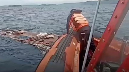 Rescuers search wreckage after football coach dies in Indonesian tour boat sinking