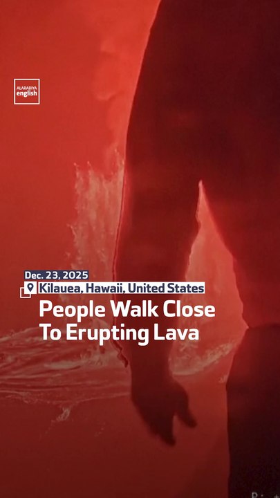 People Walk Close To Erupting Lava