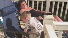Woman gets scared by a scream while trying to relax on a sun lounger