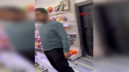 Kırtasiyede genç kızın fotoğrafını çeken şüpheliye tepki