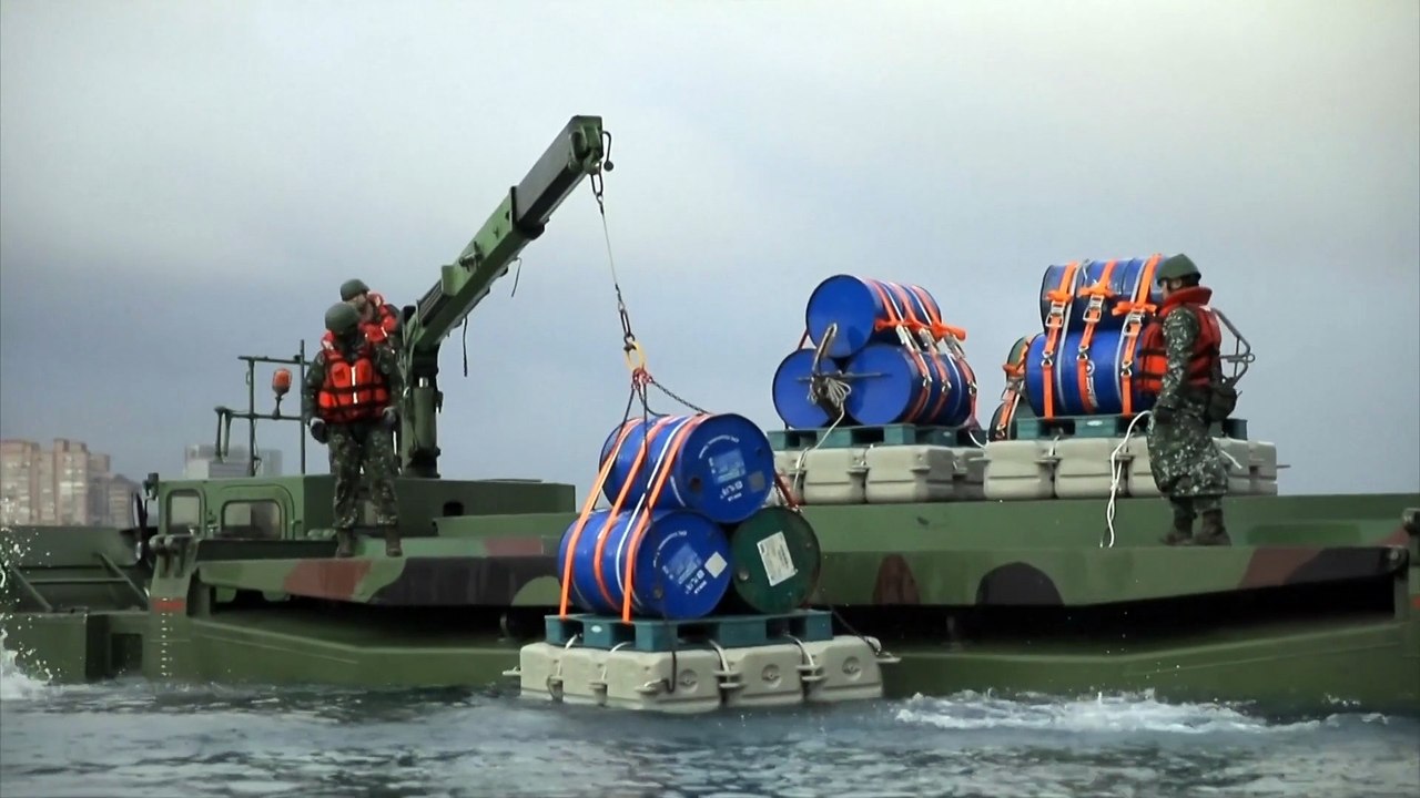 Taiwan drops "explosive barrels" in river defense drill as China encircles island