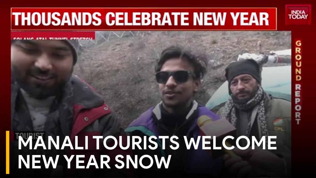 Tourists celebrate New Year with fresh snowfall near Atal Tunnel in Solang