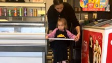 Little girl sneezes twice on freshly made fries while helping at family shop