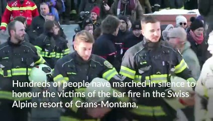 Hundreds march in silence to honour victims of Swiss bar fire